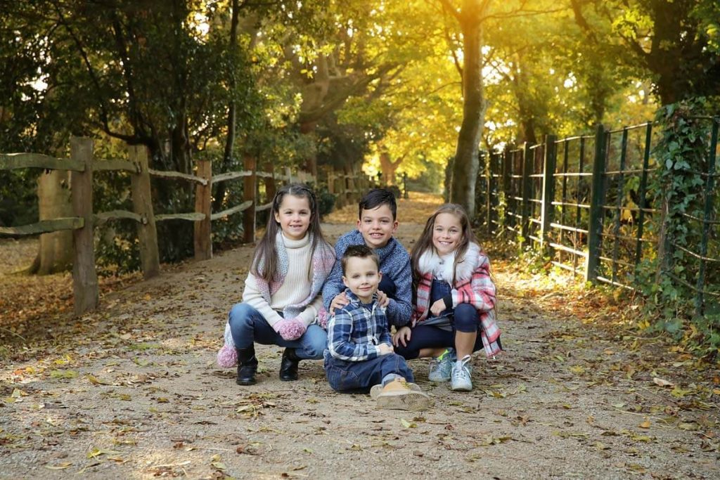 Eastbourne_family_photographer_hampden_park_powell-ful_photography four children all looking to camera