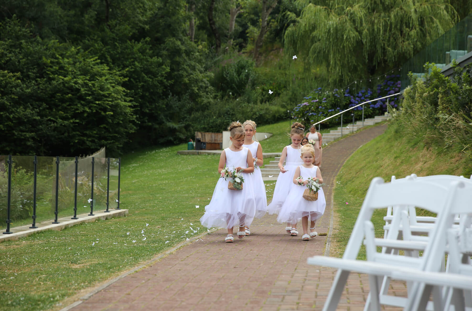 bridesmaids walking up the isle