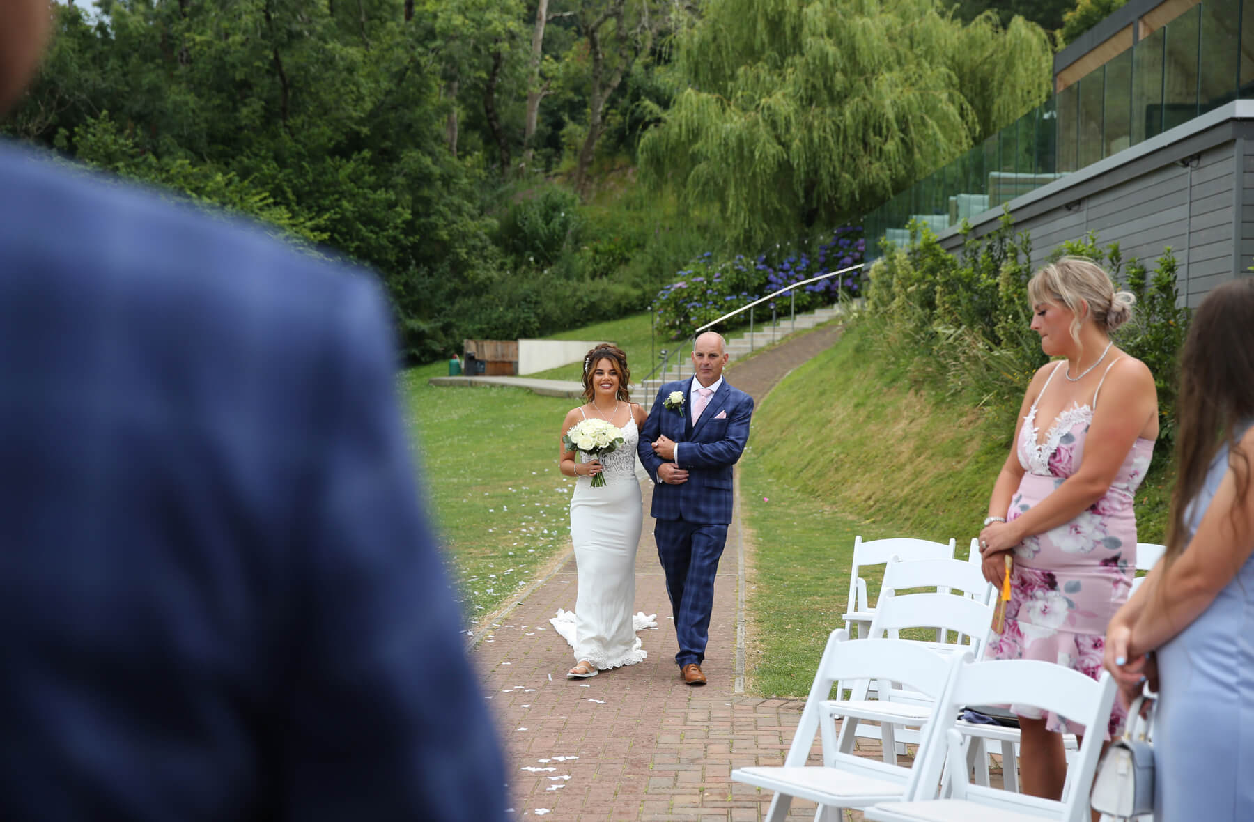 bride and dad walking up the isle