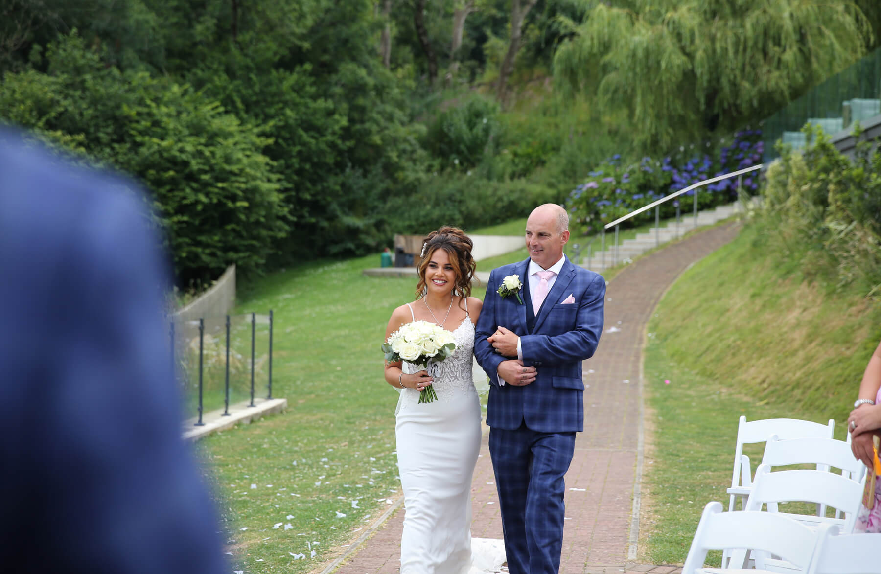 bride and dad walking up the isle