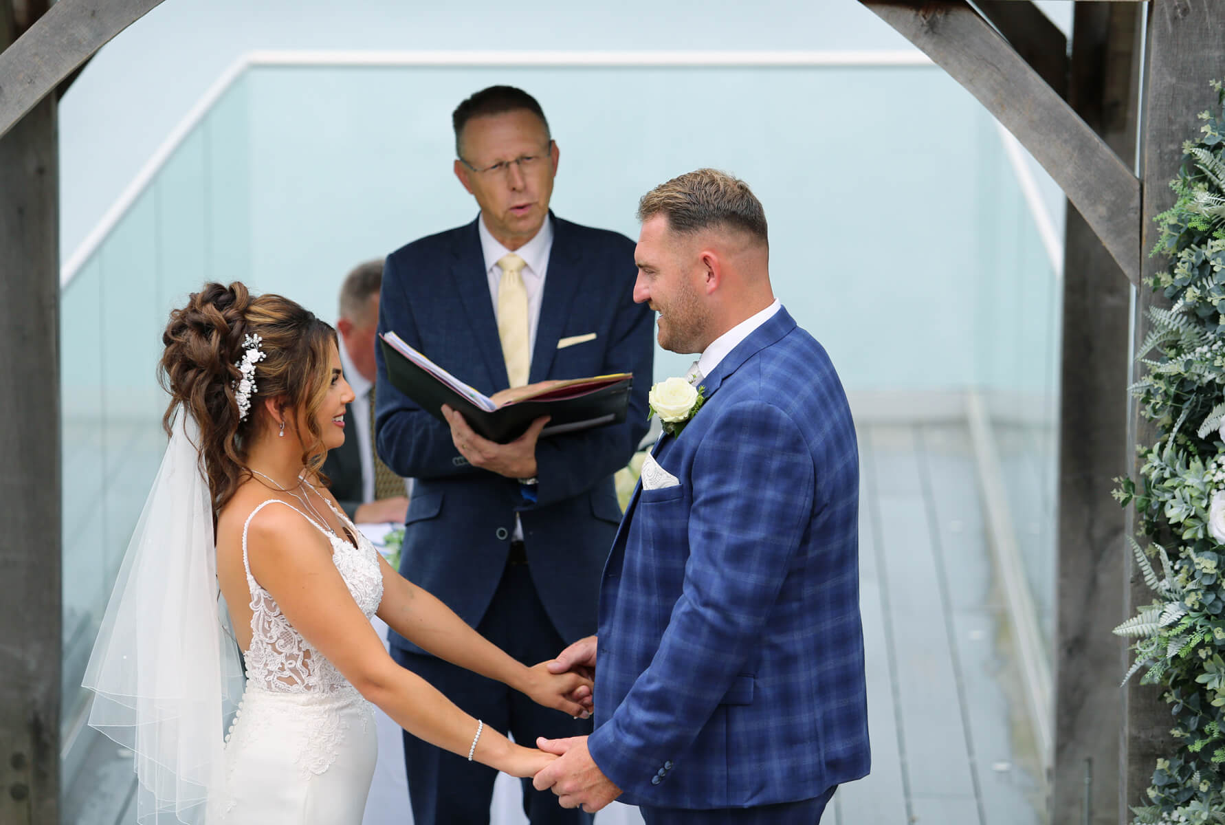 bride and groom holding hands at their ceremony