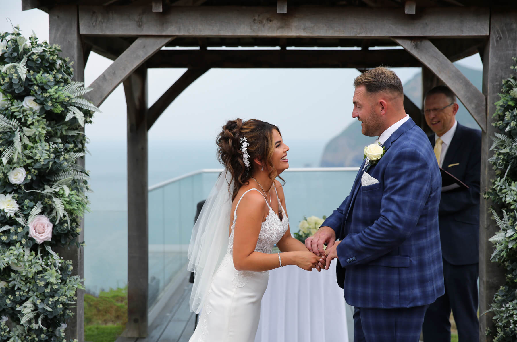 bride and groom exchanging rings