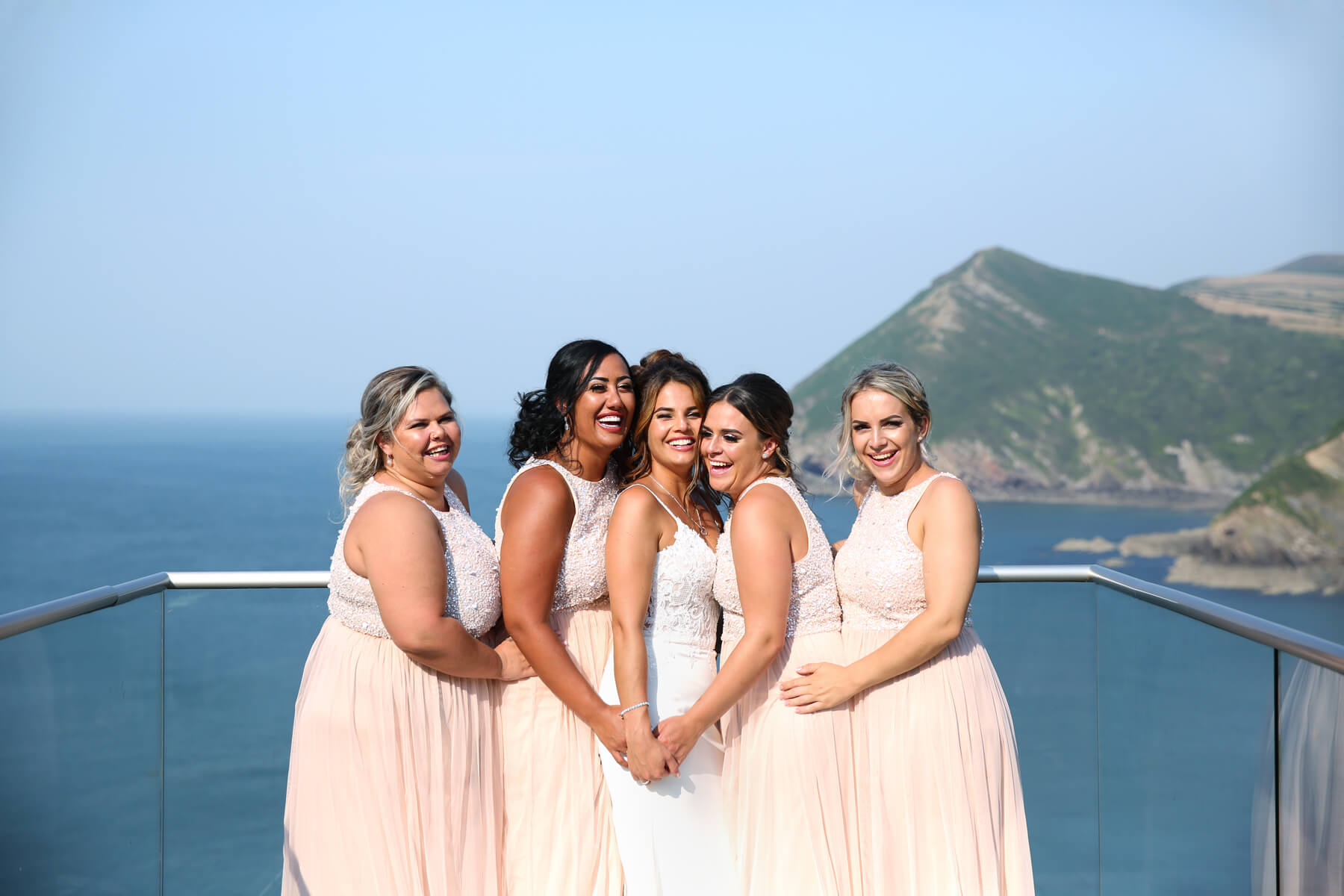 Eastbourne wedding photography bride and bridesmaids cuddling