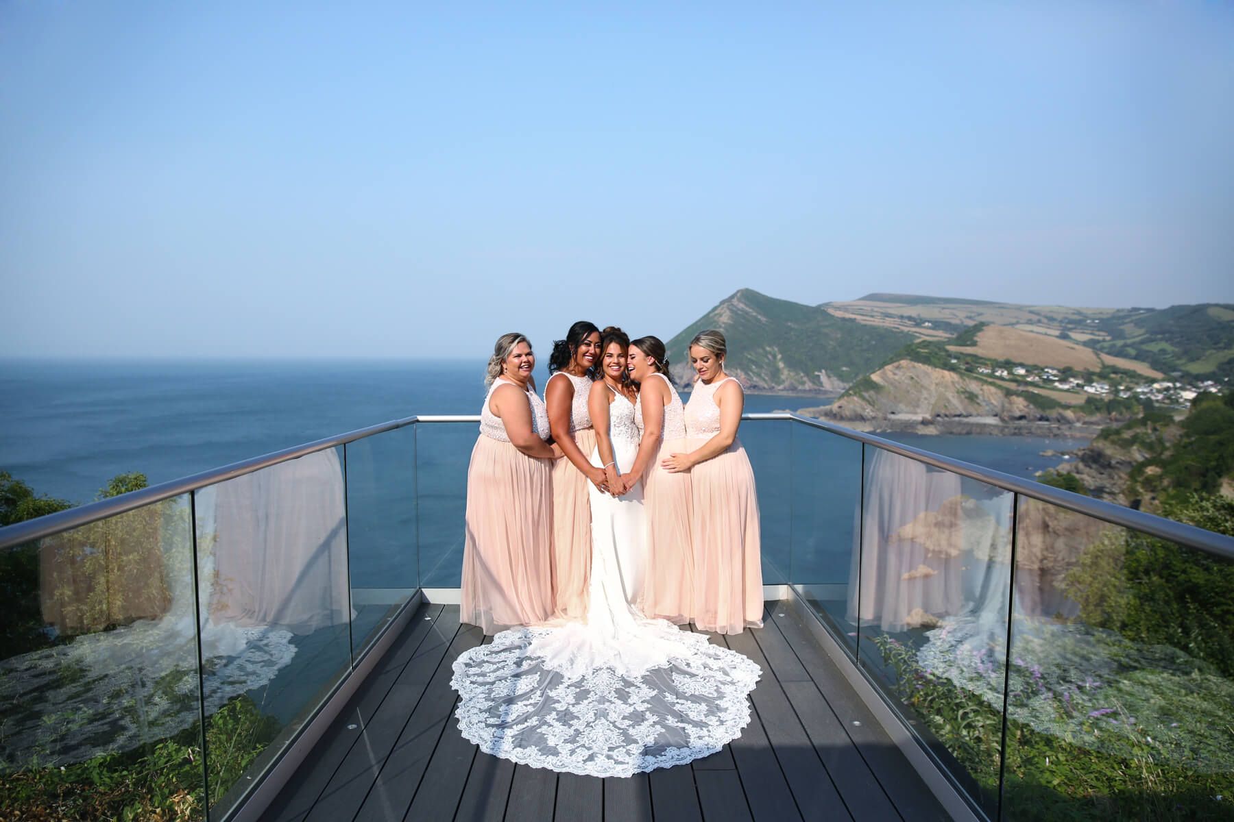 bride and bridesmaids cuddling