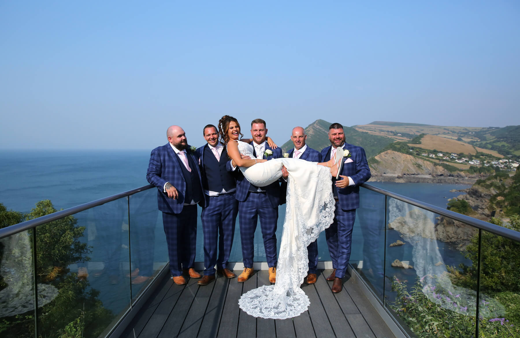 groomsmen lifting the bride