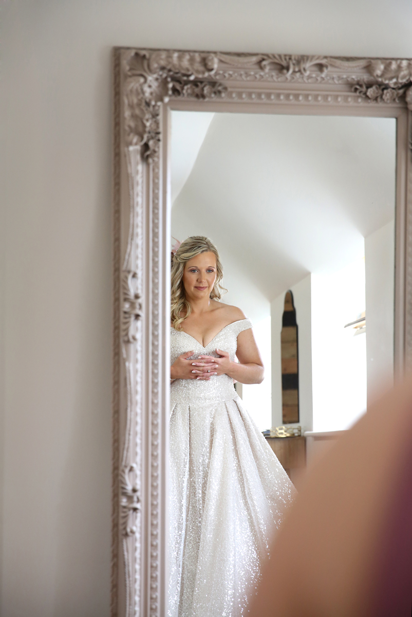 bride looking in the mirror