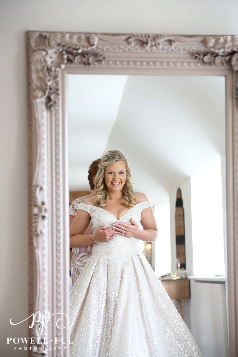 bride looking in the mirror
