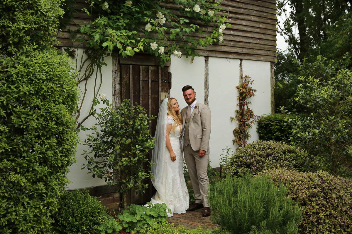 bride and groom in a garden