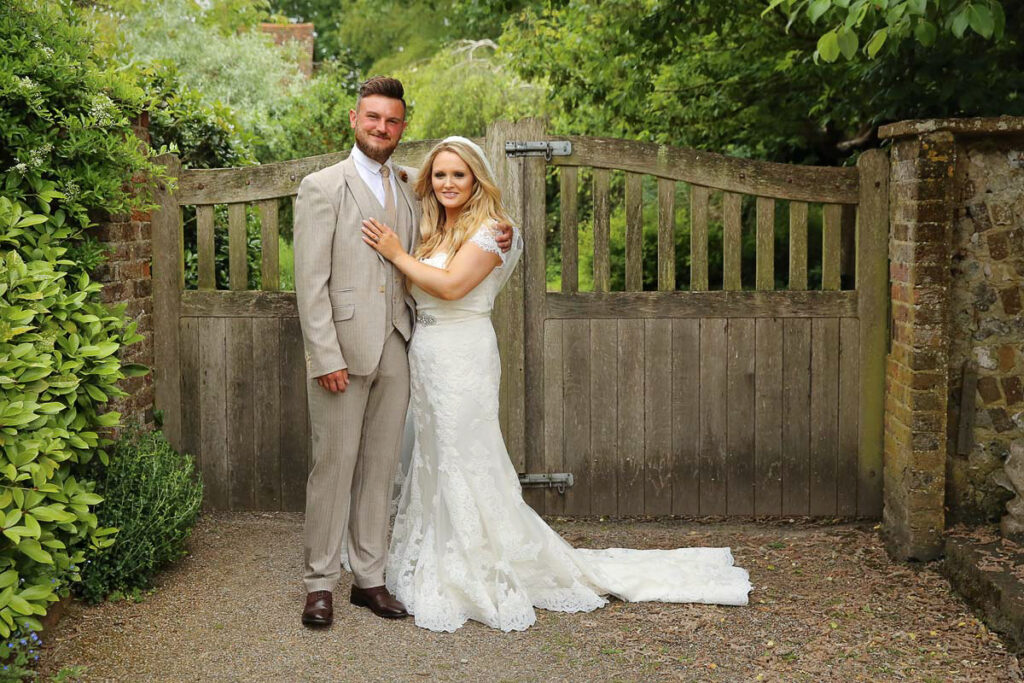 Eastbourne_wedding_photographer_the_english_wine_center_alfriston_gardens_powell-ful_photography bride and groom looking into the camera