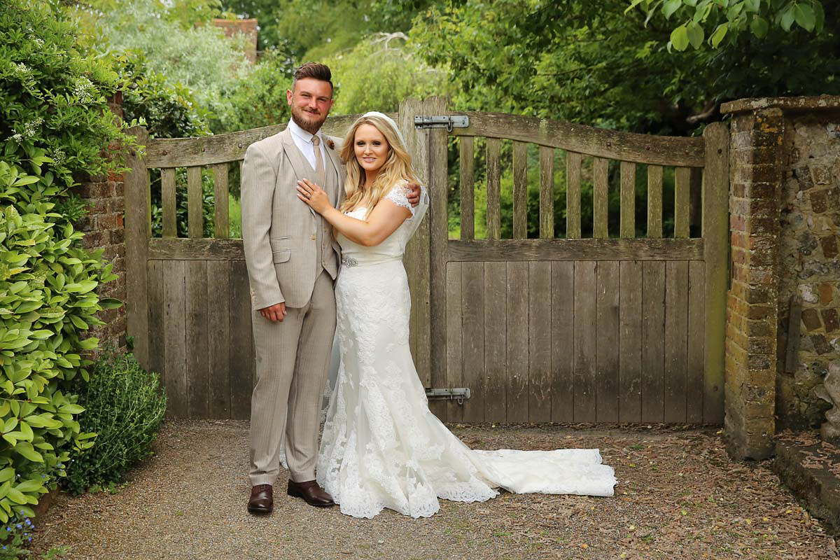 bride and groom looking into the camera