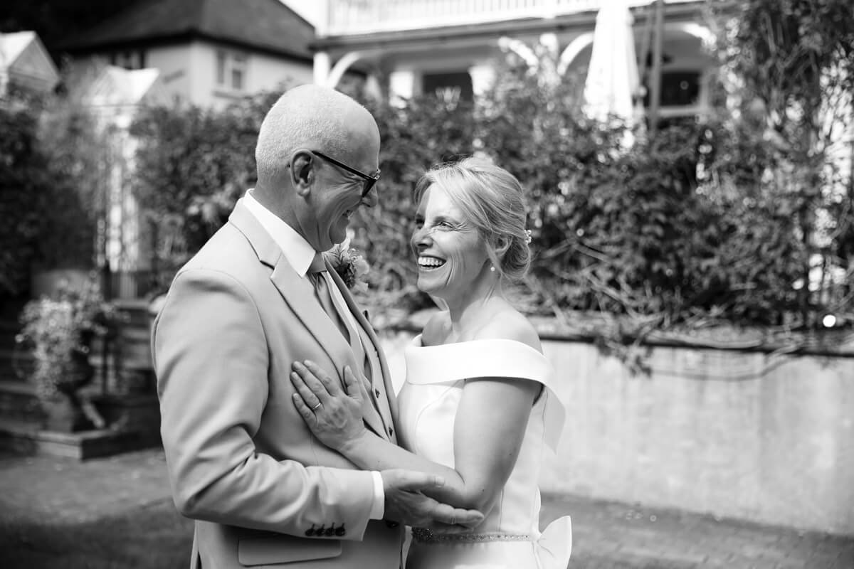 bride and groom laughing