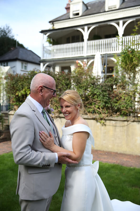 bride and groom laughing