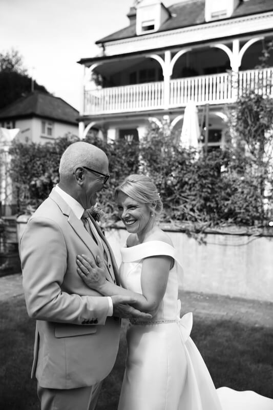 bride and groom laughing