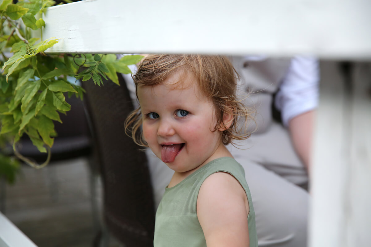 little girl sticking her tongue out