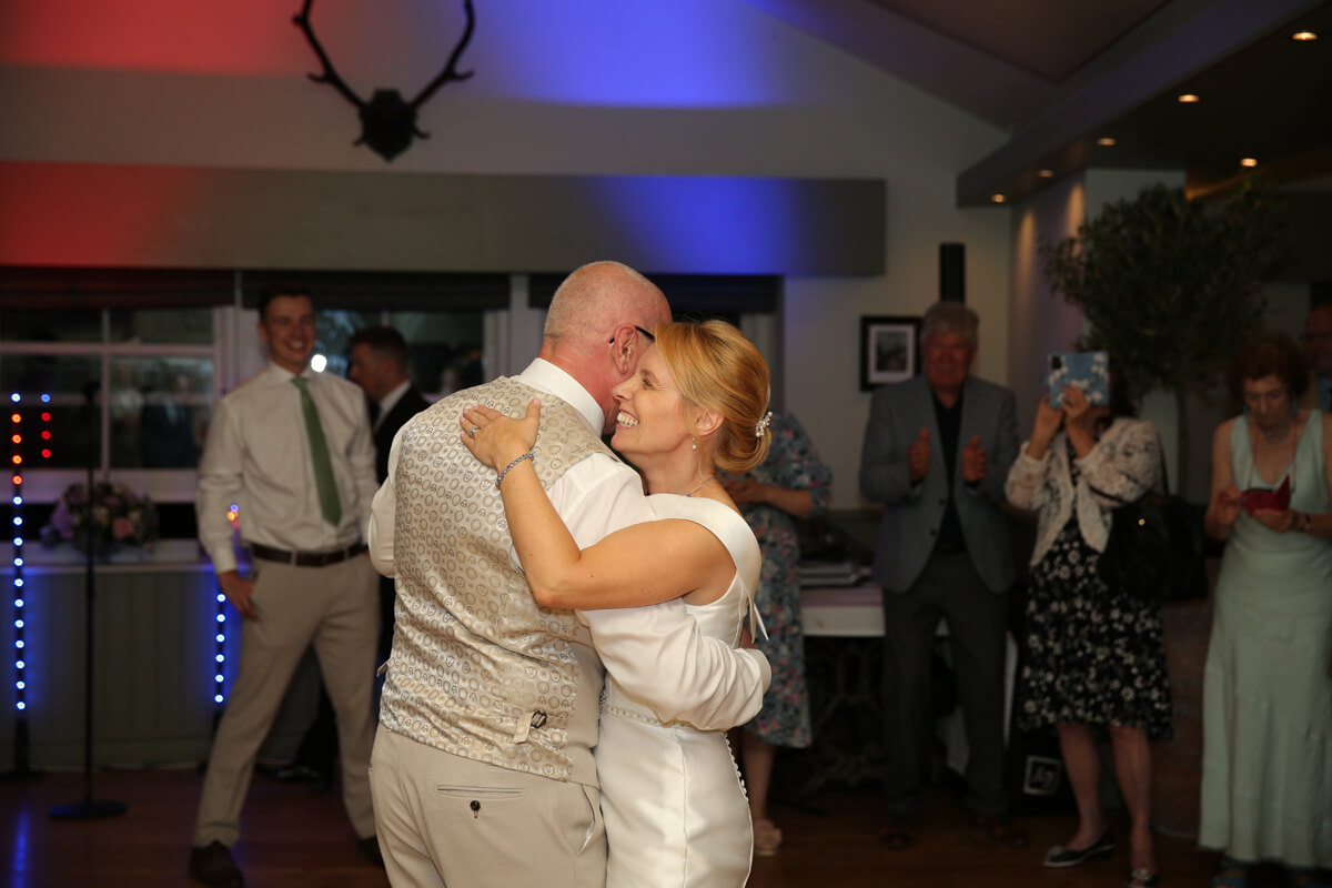 bride and groom dancing