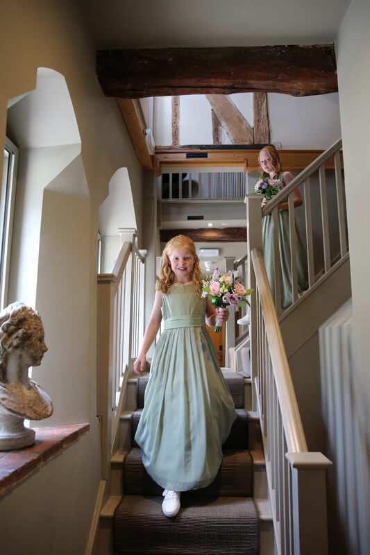 bridesmaids walking down the stairs