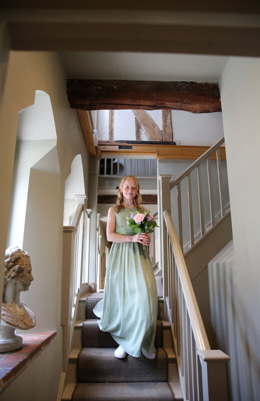 bridesmaids walking down the stairs