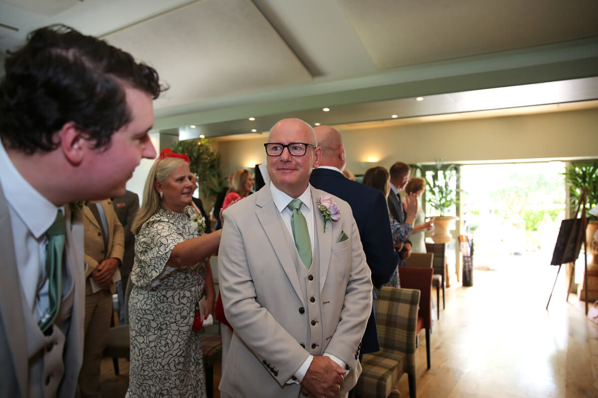 groom at the alter