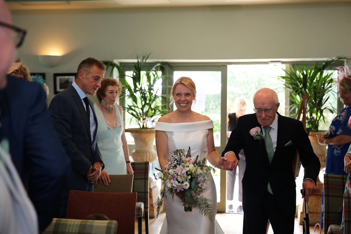 father of the bride walking his daughter up the isle