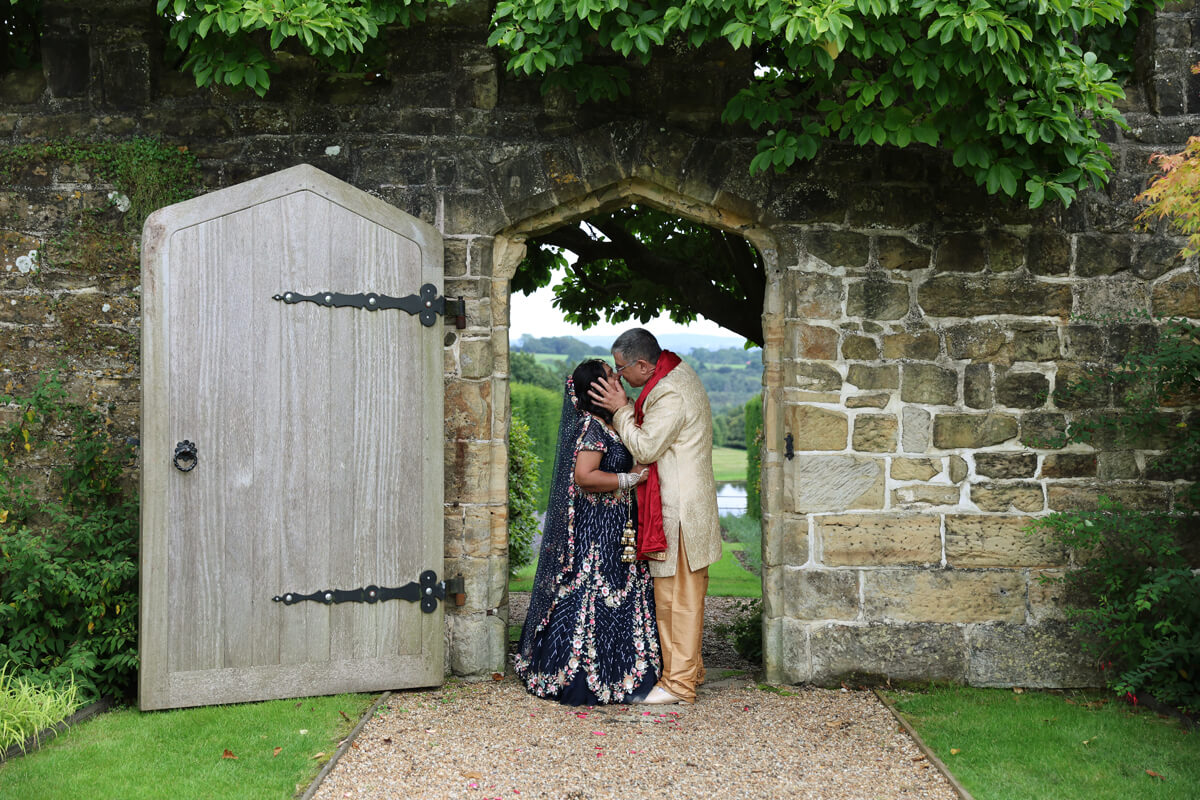 Indian wedding, bride and groom kissing