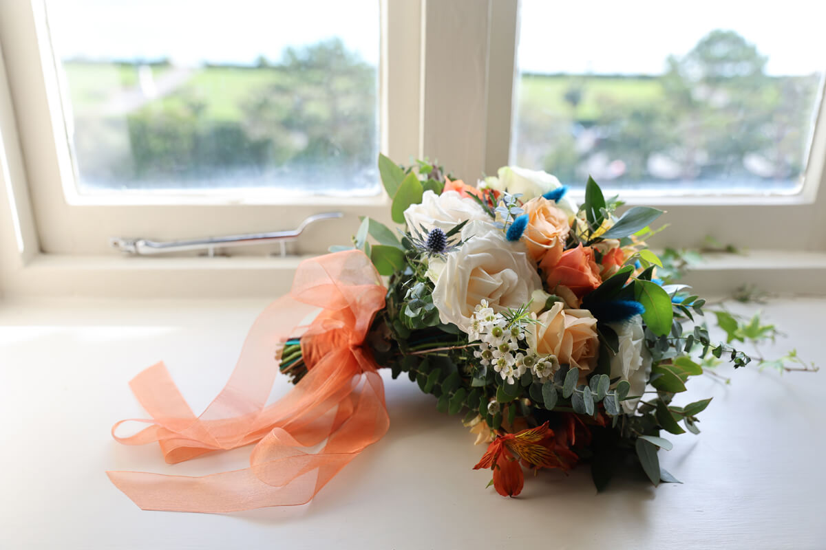 wedding flowers orange and ivory